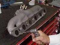 Click to see deburring of exhaust manifold - Large