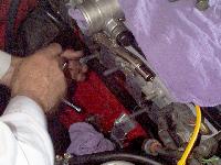 Click to see Pat inserting the manifold studs (closeup) - Large