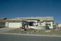 Click to see Me, Mom and Dad in front of the new homestead - Large